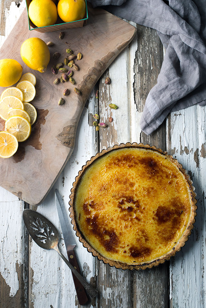 Vegan Bruleed Meyer Lemon Tart with Pistachio Crust | The filling is made with a whole Meyer lemon, rind and all, and is super easy because you just whiz it in the food processor. I love the nutty pistachio crust and the crunchy sugar top!