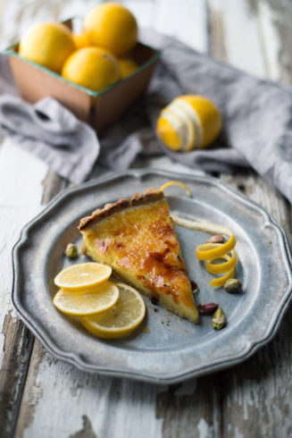 Vegan Bruleed Meyer Lemon Tart with Pistachio Crust | The filling is made with a whole Meyer lemon, rind and all, and is super easy because you just whiz it in the food processor. I love the nutty pistachio crust and the crunchy sugar top!