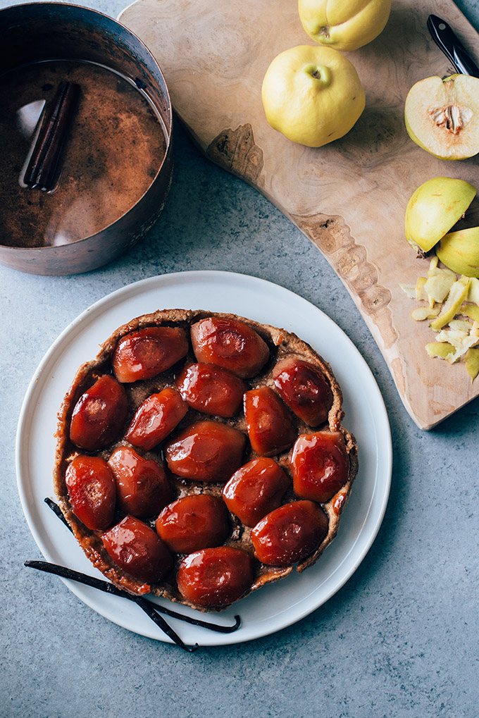 Vegan Quince Tarte Tatin with Rye Coconut Oil Crust | This rustic French dessert gets a vegan makeover with beautiful quinces flavored with maple, vanilla bean, and cinnamon stick and a rye & coconut oil crust. No butter needed!