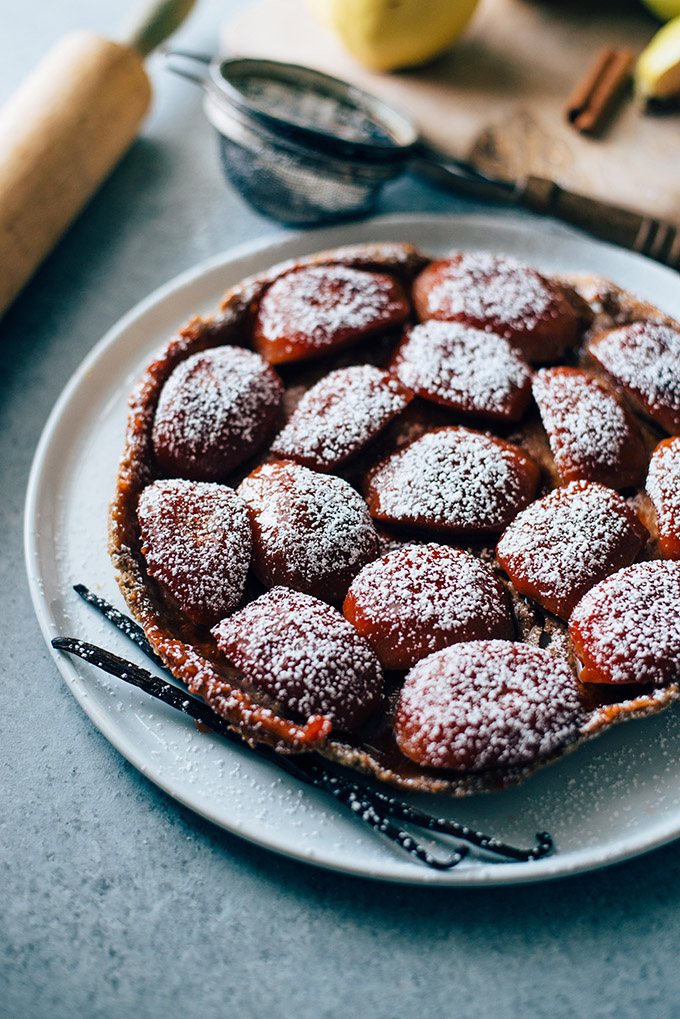 Vegan Quince Tarte Tatin with Rye Coconut Oil Crust | This rustic French dessert gets a vegan makeover with beautiful quinces flavored with maple, vanilla bean, and cinnamon stick and a rye & coconut oil crust. No butter needed!