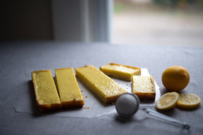 Meyer Lemon Bars (Vegan) | These vegan lemon bars are arguably better than "eggy" traditional lemon bars, plus they are lower in fat. Omnivores and vegans alike will absolutely love these at a potluck or bake sale.