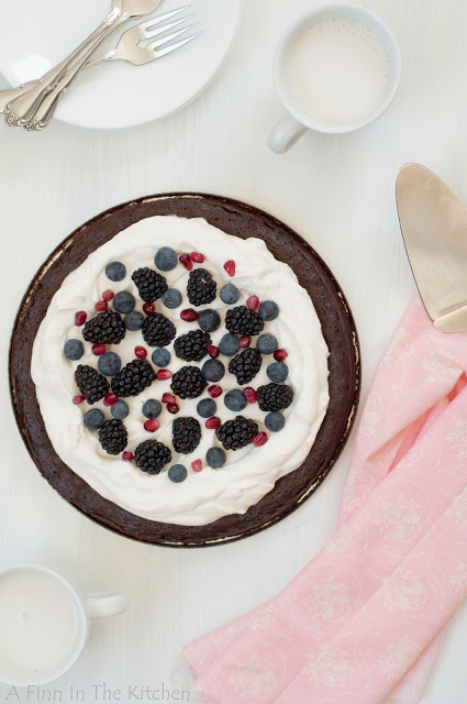 flourless chocolate honey cake with berries and a cloud of whipping cream 0899
